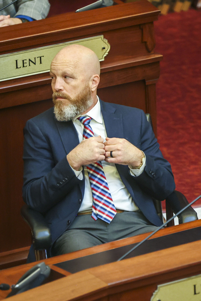 Sen. Brian Lenney, R-Nampa, listens to proceedings on the Senate floor