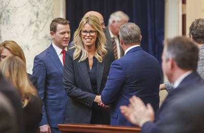 Idaho Superintendent of Public Instruction Debbie Critchfield enters the House of Representative chambers