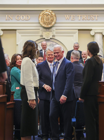 Idaho Senate Majority Leader Lori Den Hartog, R-Meridian, and Idaho House Majority Leader Jason Monks, R-Meridian, walk Gov. Brad Little out of the House chambers after the governor delivered his State of the State Address