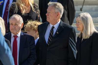 U.S. Sen. Jim Risch stands next to Idaho Gov. Brad Little at a lying in state service for former Idaho Gov. Dirk Kempthorne.