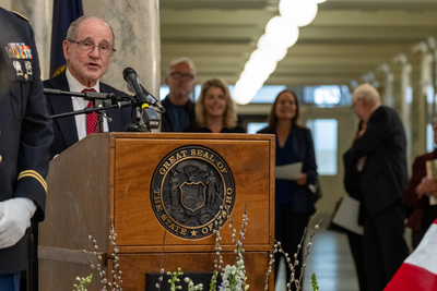 U.S. Sen. Jim Resch speaks from a lectern at a lying in state service for former Idaho Gov. Dirk Kempthorne at the Idaho State Capitol.