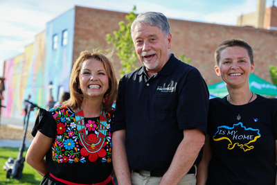 Pocatello's World Refugee Day organizers Evelyn Kistler (left) and Lena Contor (right) stand with Mayor Mark Dahlquist at the celebration