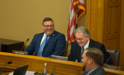 Kansas Sens. Rick Kloos and Mike Thompson laugh after an anti-abortion bill is introduced.