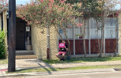 An abortion right supporter sits outside a New Orleans clinic