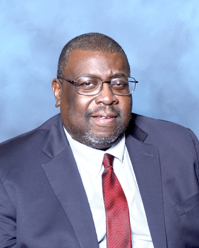 a man in a suit and a red tie