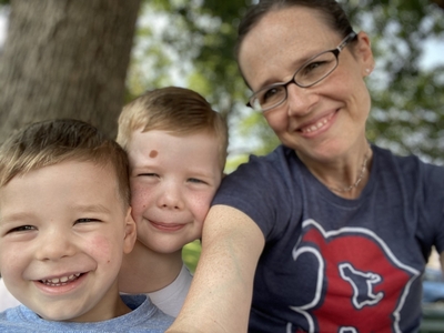 Michelle Cilley Foisy and two of her children in a family photo outside