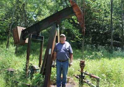 Bob Wilson, an oil producer in Washington County stands in front of one of his injection wells. (Photo by Megan Henry, Ohio Capital Journal).