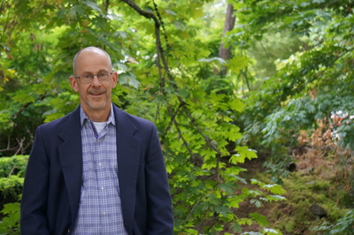Ivan Gall in front of trees