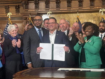 Gov. Josh Shapiro with Lt. Gov. Austin Davis (left) and House Speaker Joanna McClinton (right) at the 2025-2026 budget signing ceremony on Nov. 12, 2025 (Photo by Ian Karbal/Capital-Star)