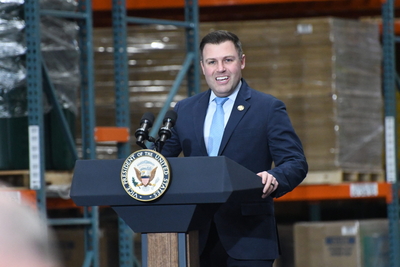 U.S. Rep. Ryan Mackenzie (R-7th District) speaks during a rally with Vice President J.D. Vance at the Uline shipping materials warehouse in Lower Macungie Township on Tuesday, Dec. 16, 2025. (Photo by Peter Hall/Capital-Star)