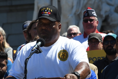 Stephen Holmes, commander of the Ephraim Slaughter American Legion Post in Harrisburg, speaks Wednesday at a rally opposing taxing skill games. (Photo by Peter Hall/Capital-Star)
