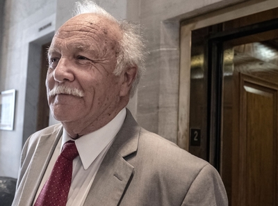 A man with white hair and a white mustache.