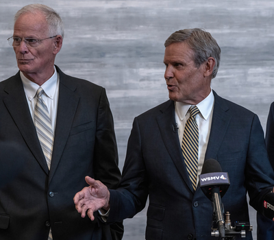 Doug Kreulen, president and CEO of Metropolitan Nashville Airport Authority, Gov. Bill Lee and U.S. Transportation Secretary Sean Duffy announce a plan for Elon Musk's Boring Company to build an underground tunnel from the airport to Downtown Nashville. (Photo: John Partipilo/Tennessee Lookout)