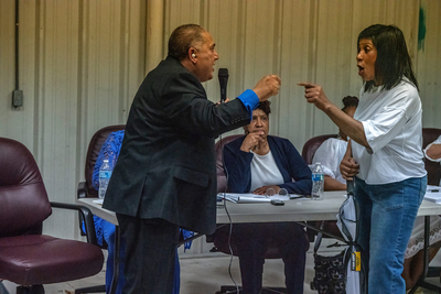 Mason, Tennessee Mayor Eddie Noeman, and Christa Poindexter, yell at each other during a Tuesday meeting of the Mason Board of Alderman. Naeman supported the creation of an Immigration and Customs Enforcement detention center; Poindexter did not. (Photo: John Partipilo/Tennessee Lookout)