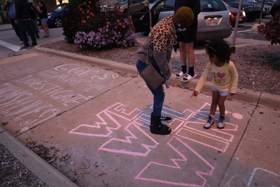 Marchers with The Peoples Revolution dance and prepare to march from Wauwatosa City Hall. (Photo by Isiah Holmes)