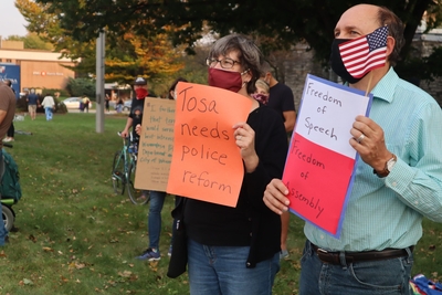 Wauwatosa residents stand outside city hall as curfew approaches. (Photo by Isiah Holmes)