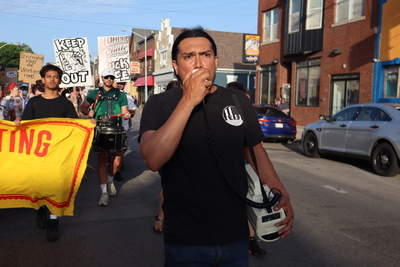 Alan Chavoya leads a march. (Photo by Isiah Holmes/Wisconsin Examiner)