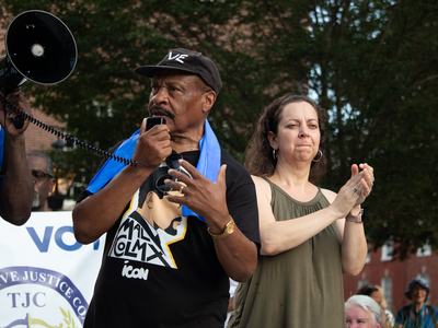 Carl Snowden speaks into a megaphone
