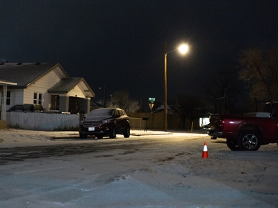 Snow began to accumulate on neighborhood streets in Amarillo on Friday evening.