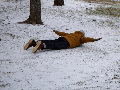Nick Wagner glided down an icy slope at Ricky Guerrero Park in Austin on Sunday afternoon.