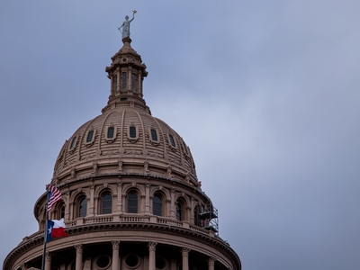 By Sunday afternoon in Austin, the precipitation had passed, but a stiff north wind still whipped the flags flying at the Capitol.