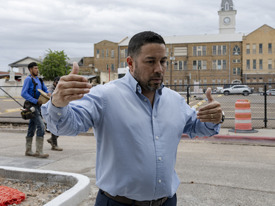 David Vazquez, president of the Downtown Laredo Business Association, leads a tour of historic sites in downtown Laredo on April 9, 2026. He says the area has long required infrastructure improvements to enhance its appeal and accessibility.