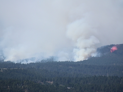 An airplane drops fire retardant chemicals near the First Thunder Fire just west of Rapid City on Sept. 3, 2024. (Seth Tupper/South Dakota Searchlight)