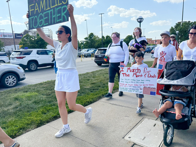 Protesters use CWS as backdrop to decry Trump immigration policies, raids