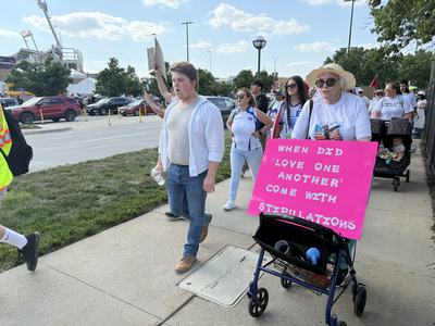 Protesters use CWS as backdrop to decry Trump immigration policies, raids
