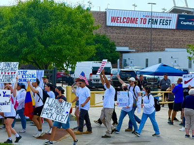 Protesters use CWS as backdrop to decry Trump immigration policies, raids
