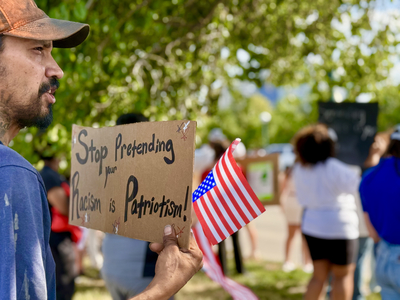 Protesters use CWS as backdrop to decry Trump immigration policies, raids