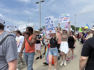 Protesters march across Little Rock's Veteran's Memorial Bridge on Saturday, June 14, 2025, as part of a national "No Kings" demonstration against Trump administration policies and actions.