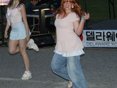 Two people dance a K-pop routine