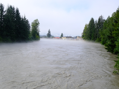 The Mendenhall River seen at flood levels, just a few hours after the record-breaking peak of 16.65 feet, from the Brotherhood Bridge in Juneau on Aug 13, 2025 (Photo by Corinne Smith/Alaska Beacon)