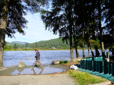 Juneau residents came to see the flooded Mendenhall River on Aug 13, 2025 (Photo by Corinne Smith/Alaska Beacon)
