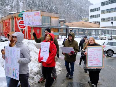 Demonstrators with the Key Coalition march through Downtown Juneau on Mar. 18, 2026. (Photo by Corinne Smith/Alaska Beacon)