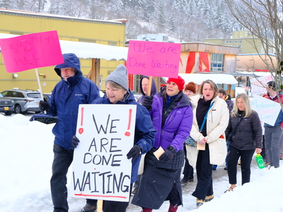 Demonstrators with the Key Coalition march through Downtown Juneau on Mar. 18, 2026. (Photo by Corinne Smith/Alaska Beacon)