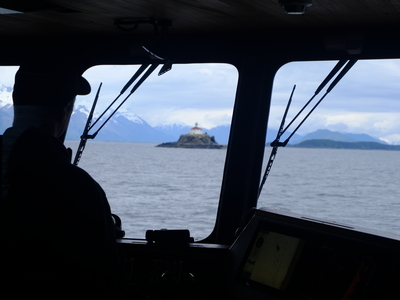 The captain of the M/V Seawolf spots the Eldred Rock Lighthouse from the south on May 30, 2026. (Photo by Corinne Smith/Alaska Beacon)