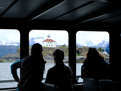 Passengers on the M/V Seawolf look out at the Eldred Rock Lighthouse on the day of the public opening on May 30, 2026. (Photo by Corinne Smith/Alaska Beacon)