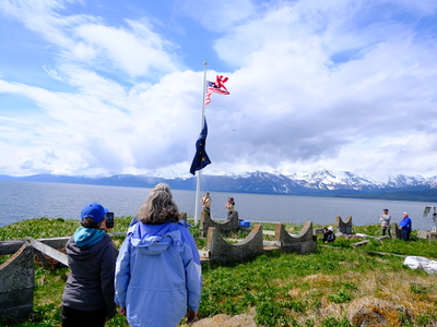 Eava Staira Lockie 16, and Jeff ivaniszek, 16, of Scouting America's Troop 6 in Juneau raise the flags in an opening ceremony on May 30, 2026. (Photo by Corinne Smith/Alaska Beacon)