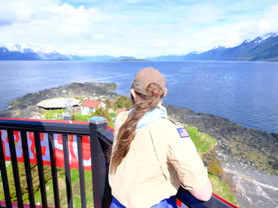 Scout Eava Staira Lockie of Juneau is seen enjoying the view looking north from the top of Eldred Rock Lighthouse on May 30, 2026. (Photo by Corinne Smith/Alaska Beacon)