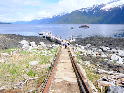 Volunteers continue work on installing a dock and gangway, the last piece for groups of visitors to safely arrive and depart from Eldred Rock Lighthouse, expected to be completed in the next few days following the opening ceremony on May 30, 2026. (Photo by Corinne Smith/Alaska Beacon)