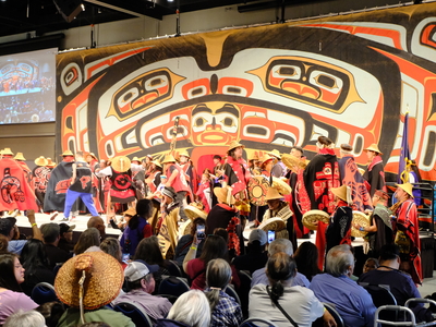 Dancers cross the stage at Juneau's Centennial Hall as part of the Grand Entrance to Celebration on June 3, 2026. (Photo by Corinne Smith/Alaska Beacon)