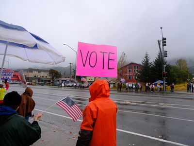 Demonstrators rally and urge early voting at a No Kings protest in Juneau on Oct. 17, 2026. (Photo by Corinne Smith/Alaska Beacon)