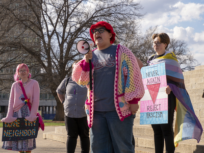 Ian Benalcázar delivers a speech Friday at the Statehouse as part of the March for Queer and Trans Youth Autonomy. 