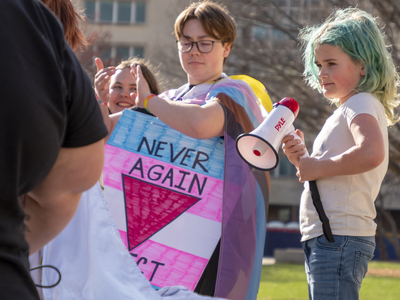 Cassandra Robinson delivers a speech Friday at the Statehouse as part of the March for Queer and Trans Youth Autonomy. 