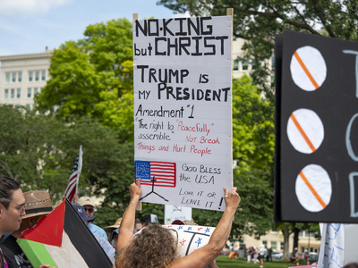 A pro-Trump counter-protestor appears at the June 14, 2025, "No Kings" rally at the Statehouse in Topeka.