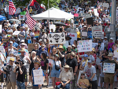 Kansans protest President Donald Trump at the June 14, 2025, "No Kings" rally at the Statehouse in Topeka.
