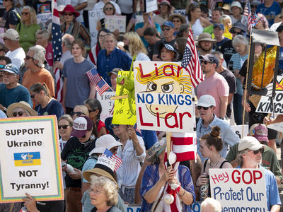 Kansans protest President Donald Trump at the June 14, 2025, "No Kings" rally at the Statehouse in Topeka.