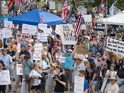 Kansans protest President Donald Trump at the June 14, 2025, "No Kings" rally at the Statehouse in Topeka.